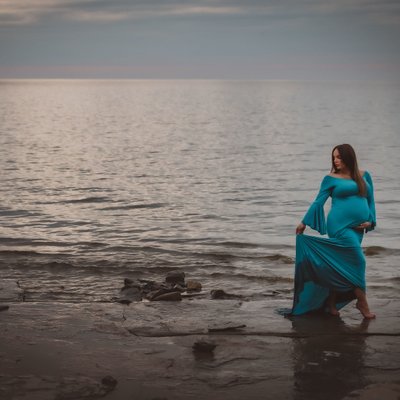 Girl Wearing Blue Maternity Dress in the Water