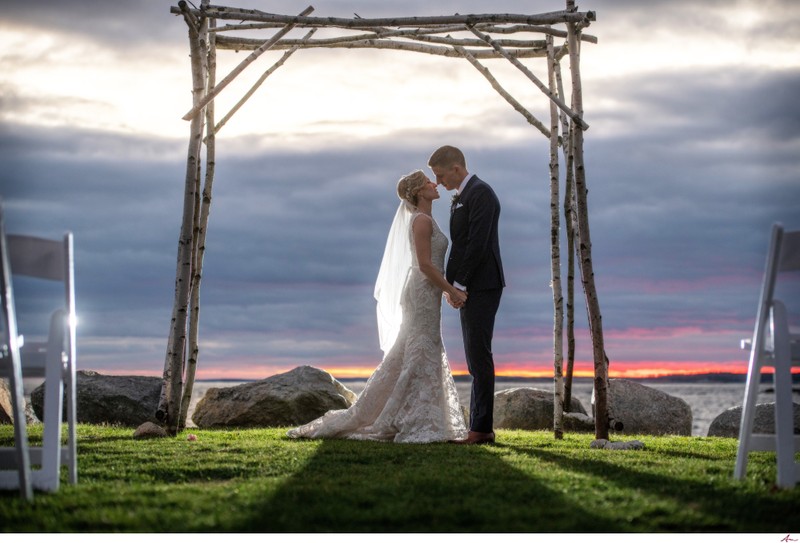 Oceanstone Couple embrace by the water