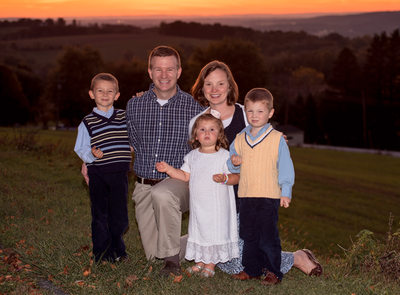 Fall sunset family photo with 3 small children