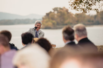 Groom's Father Playing Guitar for Wedding Ceremony