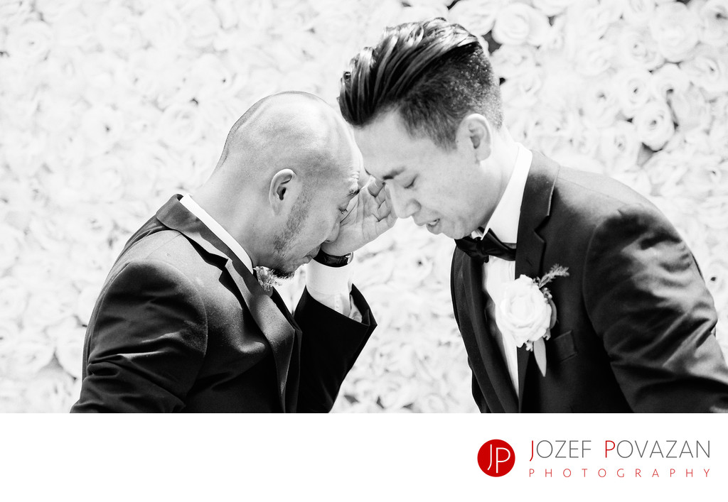 Crying groom and best man at wedding ceremony in Bali