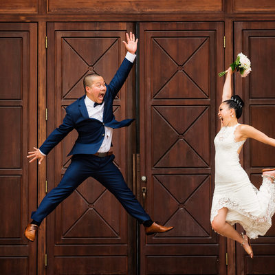 Roundhouse wedding photographer Jumping Bride and Groom