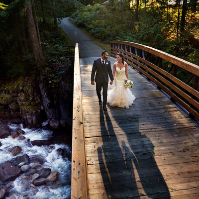 Furry Creek Wedding Bride and Groom at waterfall bridge