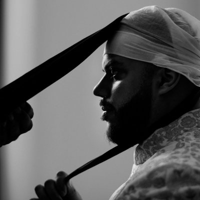 Indian groom turban tying getting ready Sikh wedding