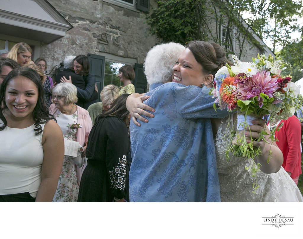 Elated Bride Hugs Grandmother at Same Sex Wedding in New Hope