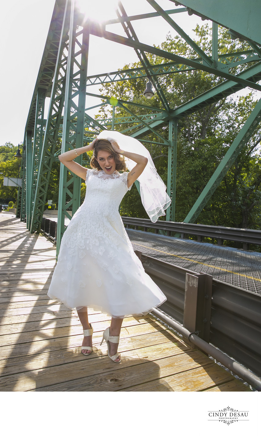Playful Bride in the Wind on Centre Bridge Wedding Photo