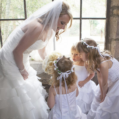 Bride Shares Bouquet with Flower Girls