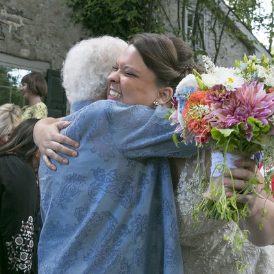Elated Bride Hugs Grandmother at Same Sex Wedding in New Hope