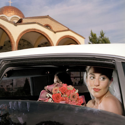 Bride in Limo Outside Greek Orthodox Church