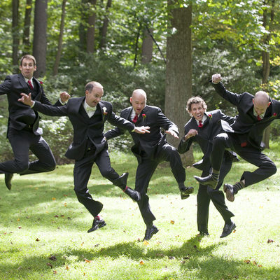 Leaping Groomsmen Having Fun Wedding Photo