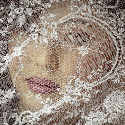 Bride Looking Through Lace Veil