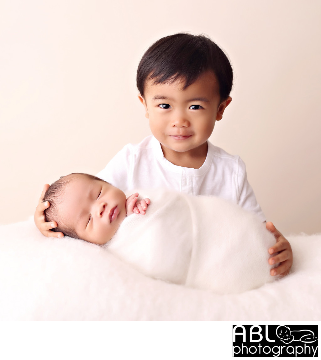 Boy with his newborn brother