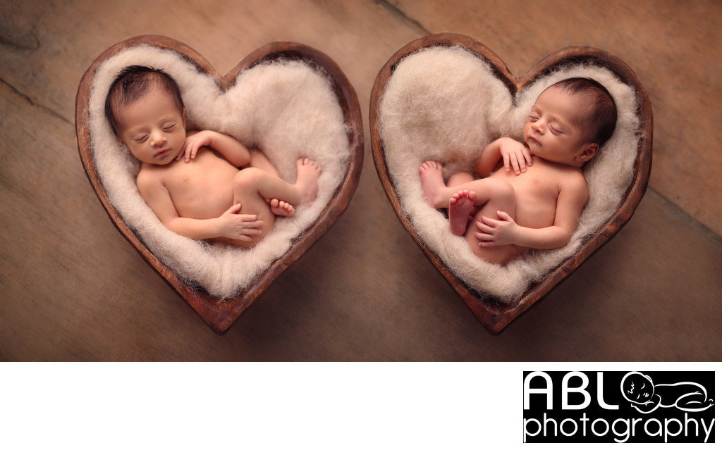 Twin newborn photography studio with heart props