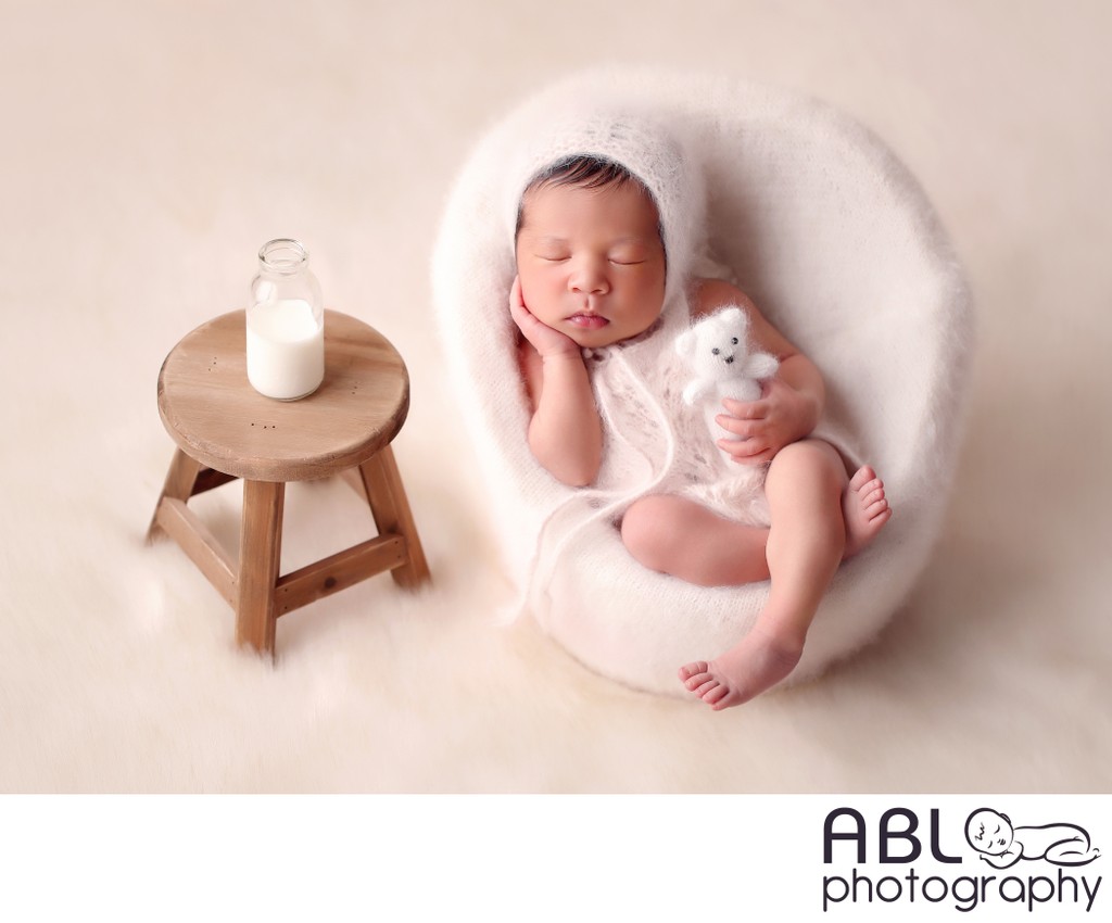 La Jolla infant photographer, baby in chair with milk