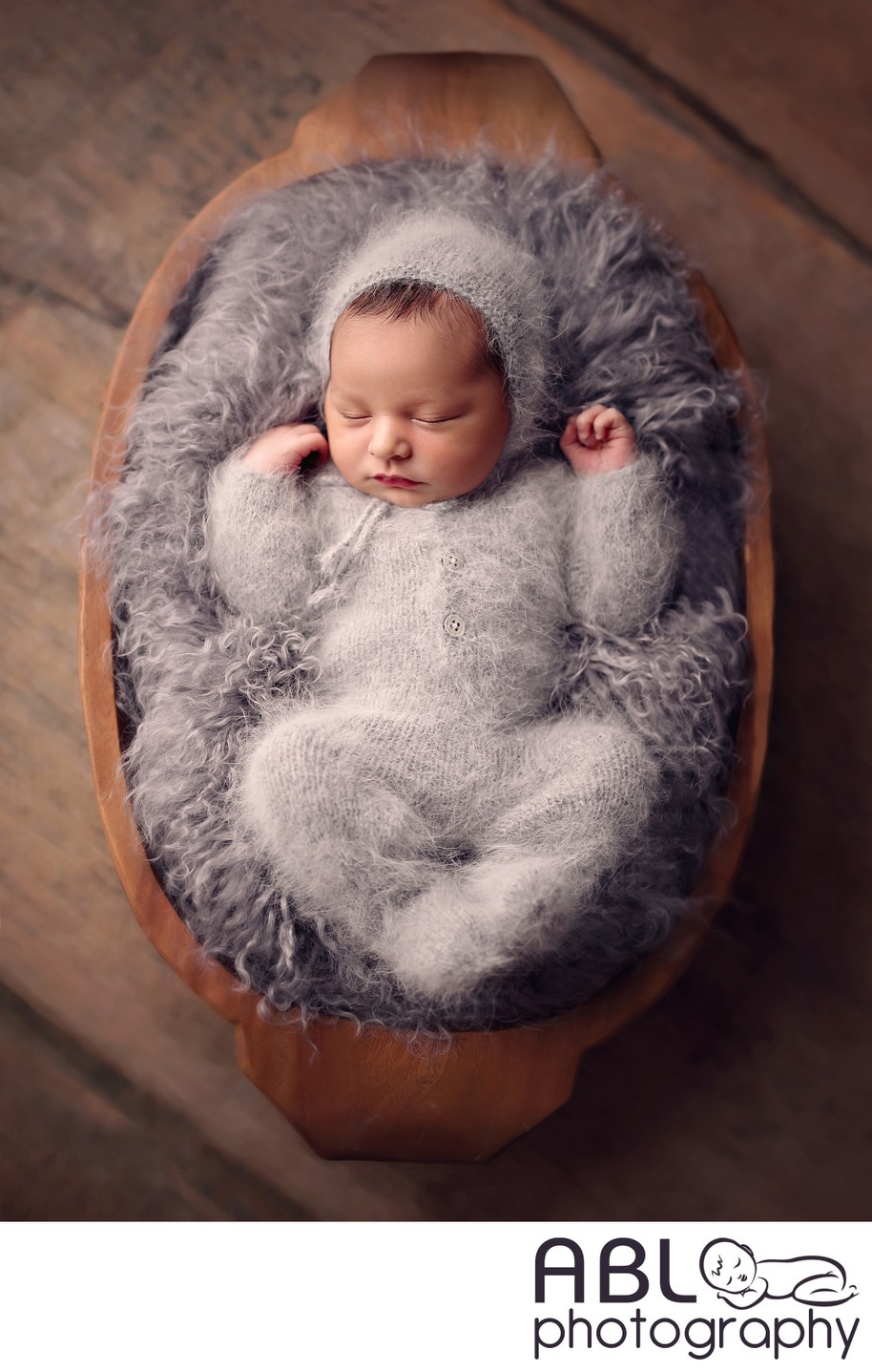 Baby in gray fluffy outfit