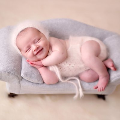 newborn girl smiling