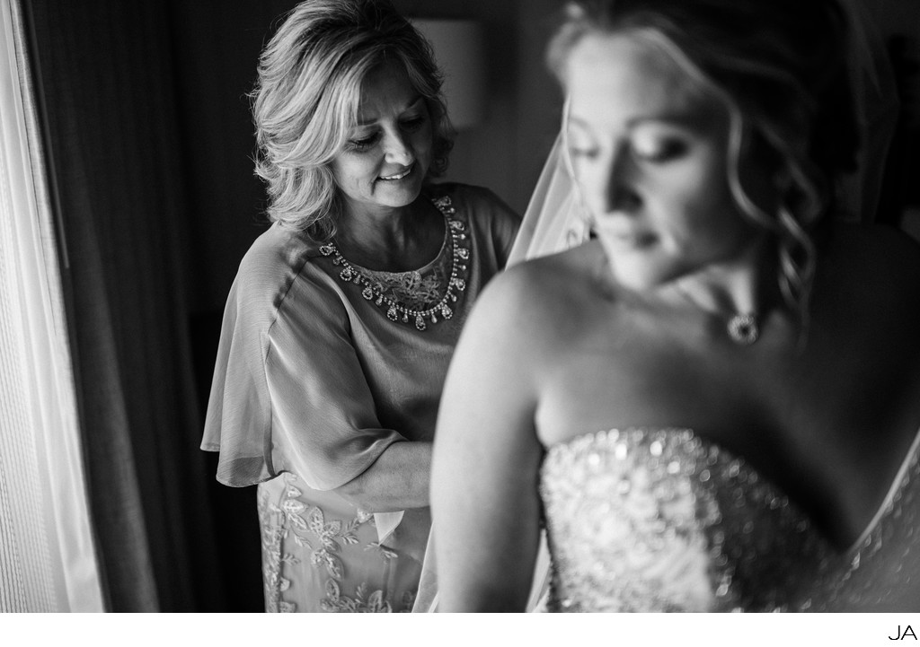 Bridal Prep - Mother lacing up the back of her dress