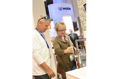 trade show photographer Moen Booth with customers