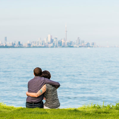 Toronto couple gazing upon downtown and CN tower