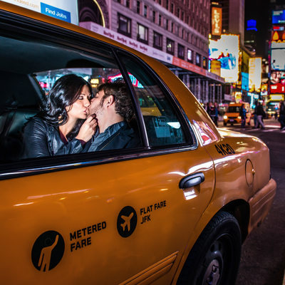 Couple Kissing in NYC Taxi Cab in Times Square