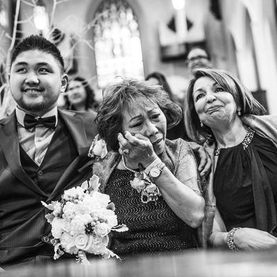 Bride's Mom Wiping Tears Away at Church