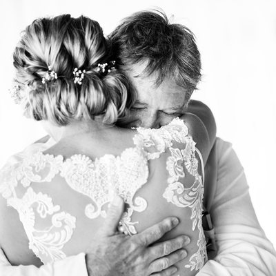 Bride and Father Embrace After First Look