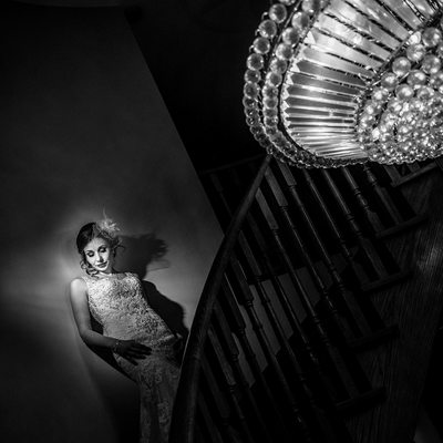 Bride on Stairs with Chandelier 