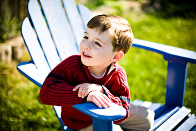 young-boy-blue-adirondack-chair