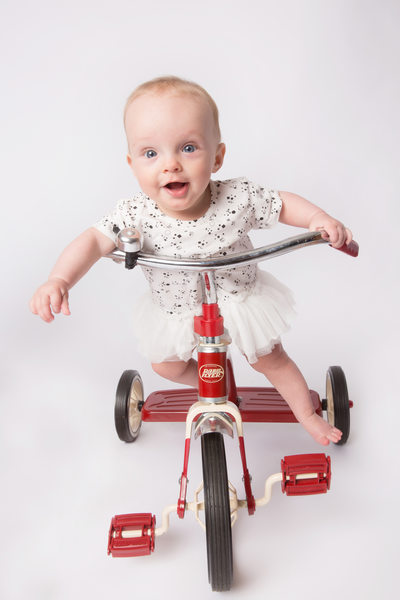 baby-girl-red-tricycle