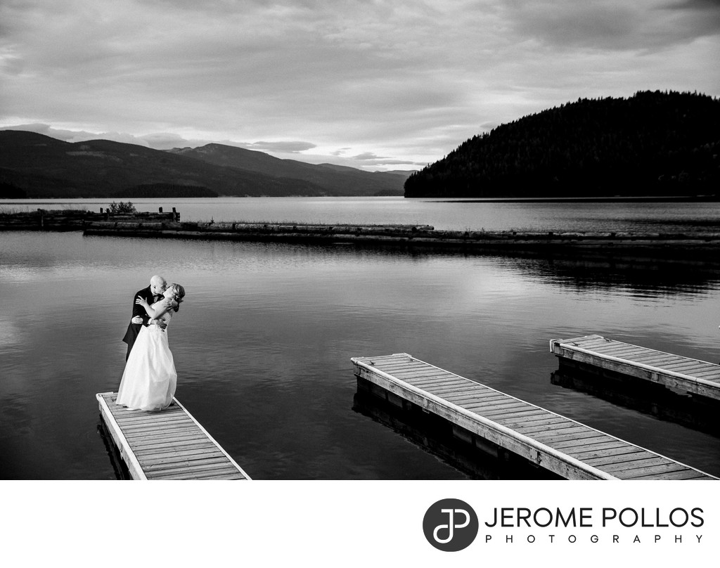Bride And Groom Kiss On Elkins Resort On Priest Lake