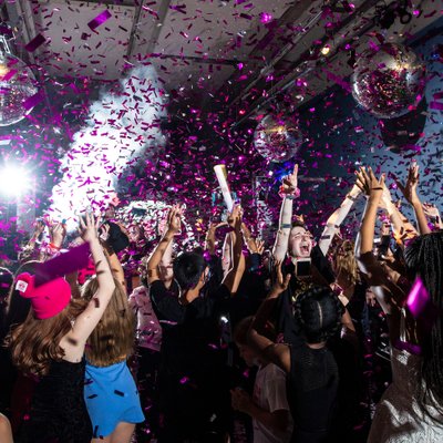 purple confetti sprayed on the dance floor