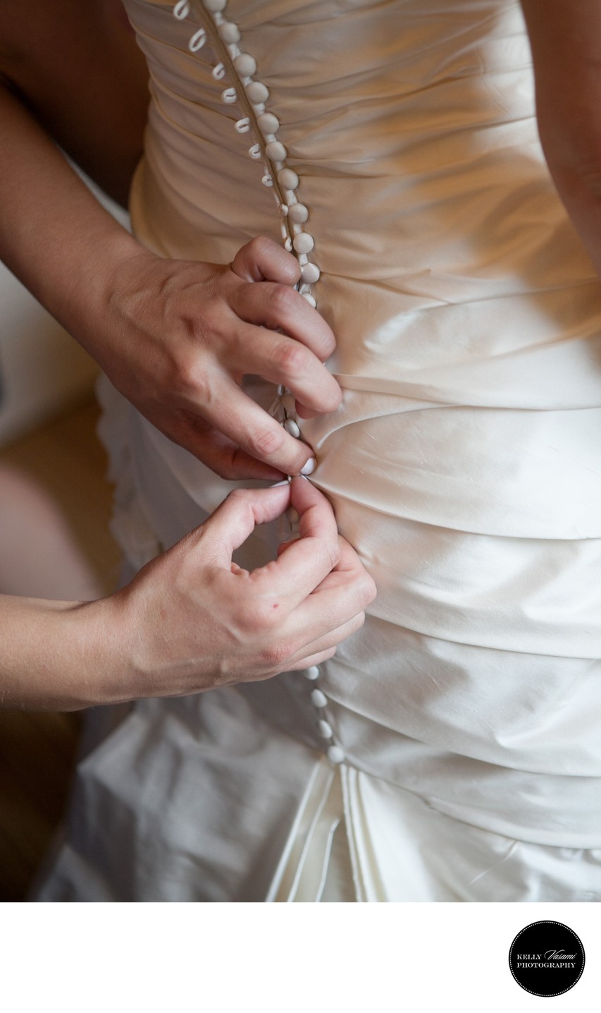 Buttoning Up The Bride's Wedding Gown | White Plains 