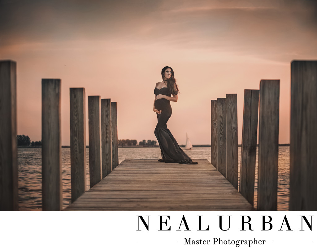 buffalo maternity photography at waterfront by the water pier with sail boat