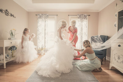 bride getting ready with mother flower girl moh dress