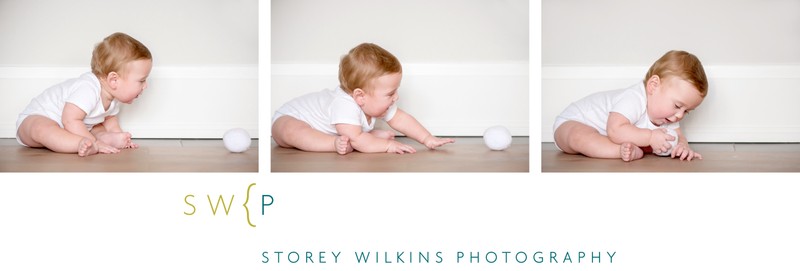 Baby Plays with Fluffy Ball During Portrait Session
