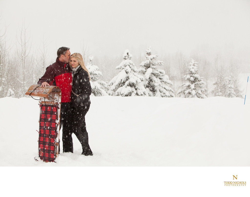 Snowy Sun Valley Engagement Session With Toboggan