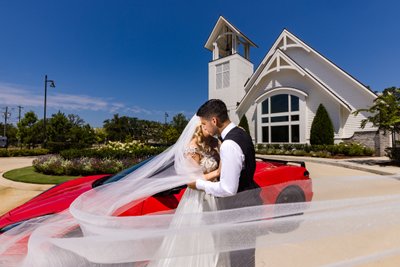 Swoosh veil in front of red corvette