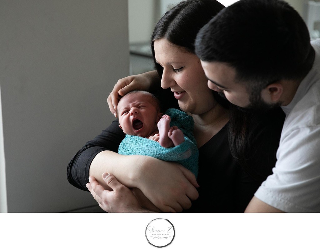 Newborn sessions in the comfort of your home, showing the nursery and your new baby at home with family. Photography by Shannon Z Photography.