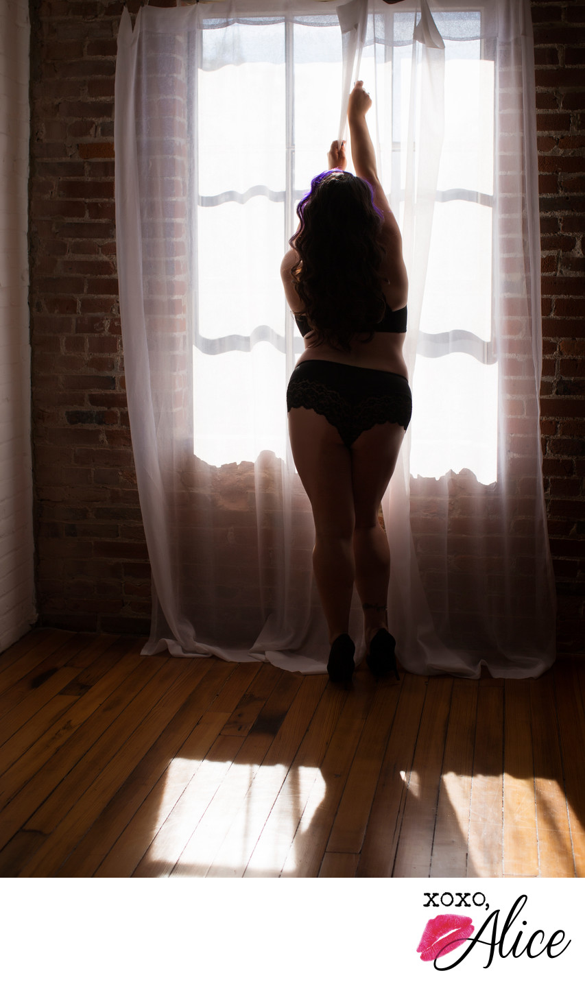 Sexy silhouette boudoir photography with a window