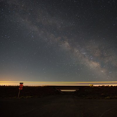 Milky way with car lights highway 70 in Utah