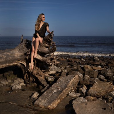 Epic beach photoshoot with driftwood and woven leather