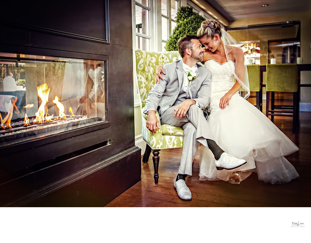 Bride and Groom enjoy fireplace at L'Auberge