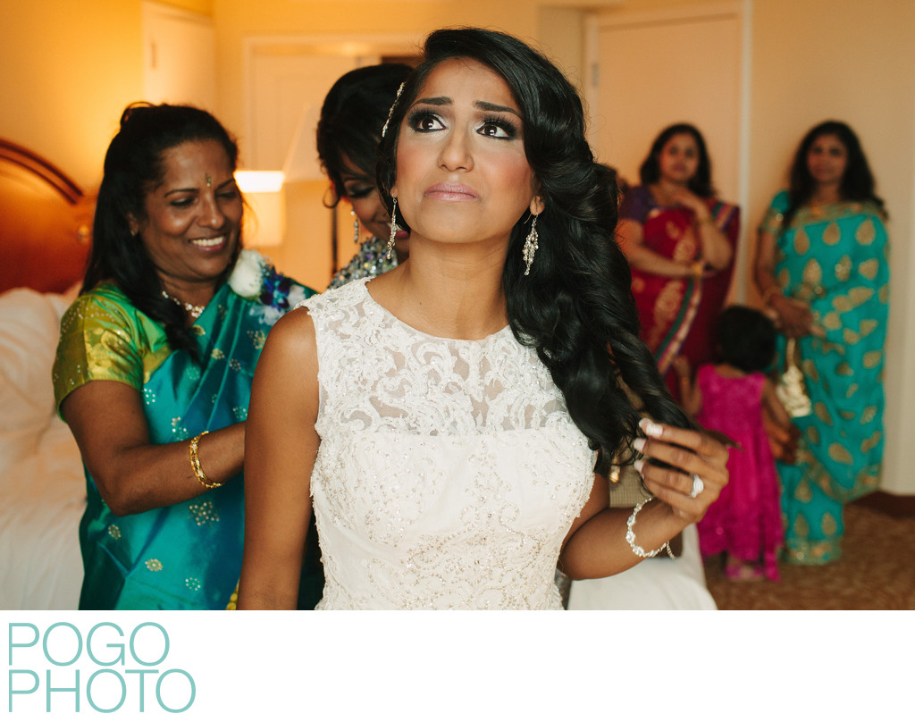 Indian Bride in White Lace Dress and Family in Saris