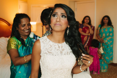 Indian Bride in White Lace Dress and Family in Saris