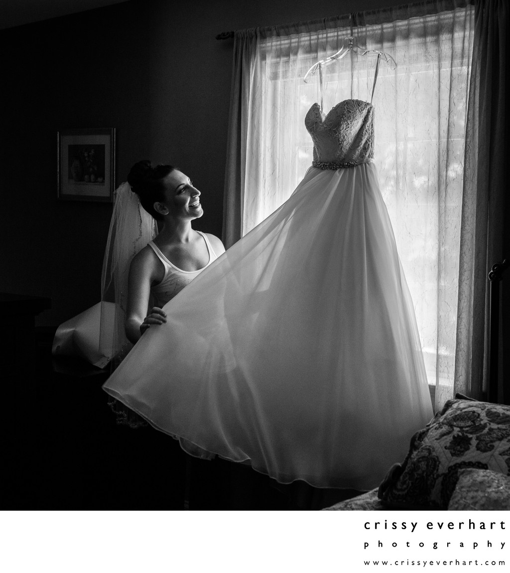 Bride with Wedding Dress by Window Light
