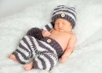 Newborn Photos in Knit Pants and Hat