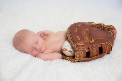 Newborn Photographer - Baby in Dad's Baseball Mitt