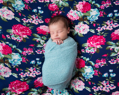 Newborn Girl on Floral Blanket, Pink and Teal