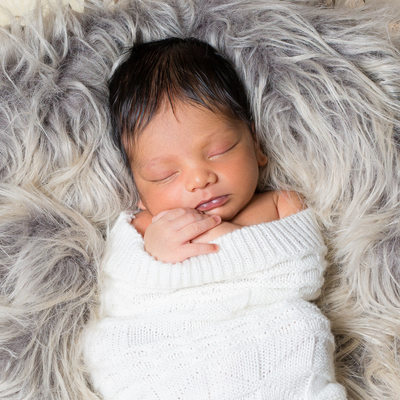 Newborn Boy on Faux Fur - In Home Portrait Session
