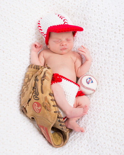 Baby in Knit Phillies Outfit with Baseball and Glove